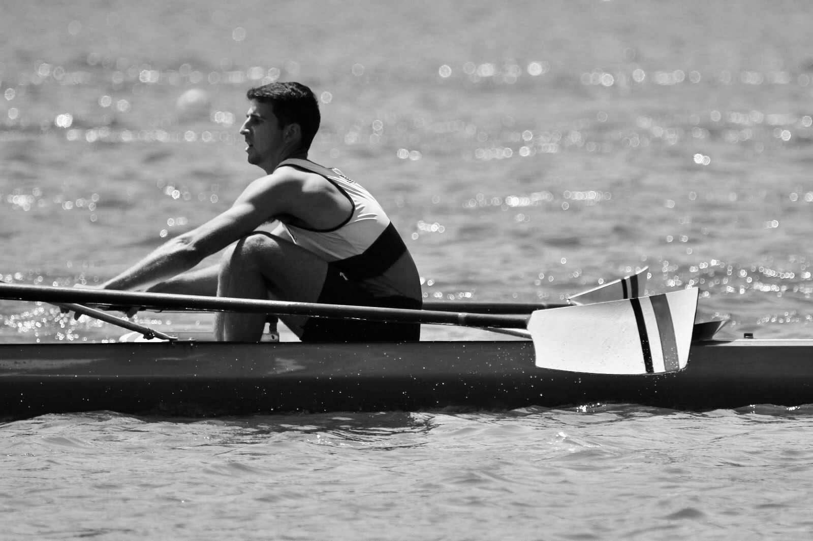 Student rowing in river